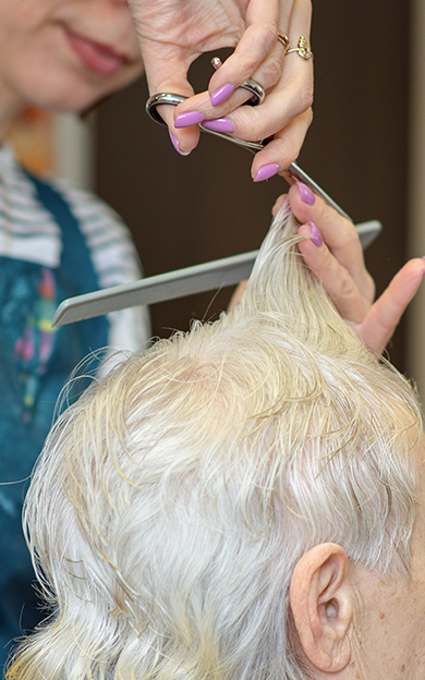 Resident getting haircut